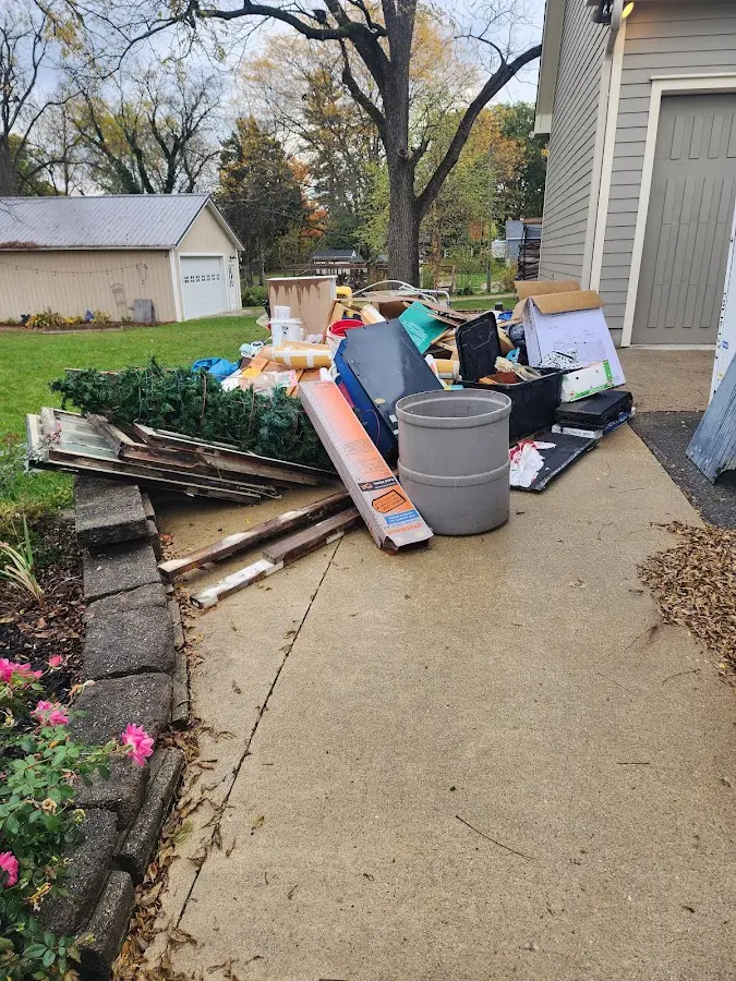 Dumpster being loaded with debris for Residential Dumpster Rental in Brookfield
